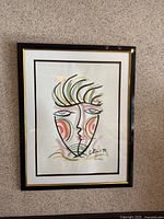 Front view of framed Michael Close watercolour