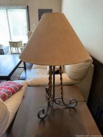 Full view of lamp on table showing shade and base