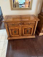 Front view of Hibriten server showing drawer, doors, hardware, and finish