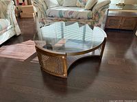 Full view of coffee table showing glass top and base