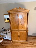 Front view of full armoire showing design, doors closed