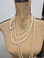 Necklaces displayed on mannequin showing overall appearance
