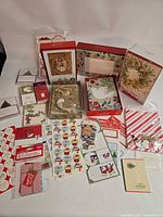 All items laid out showing quantity and variety: boxed cards, sticker sheets, treat bags, tags