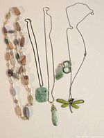 All eight jewellery pieces laid out