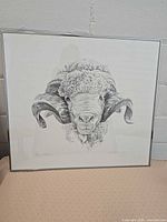 Full view of framed ram print showing artwork, frame and glass