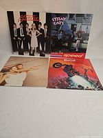 Group shot of all four LP covers