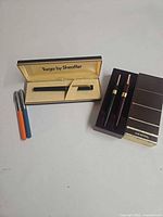 Overview of all five pens with both Sheaffer boxes