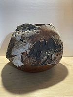 full view of rounded textured ceramic sculpture