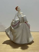 Front view of Royal Doulton Carol figurine
