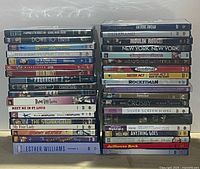 Wide shot showing two stacks of DVDs (approx. 34 pieces)