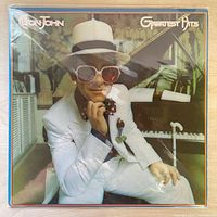 Front cover showing Elton John seated at piano