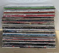 Stack of vinyl LP records showing numerous spines