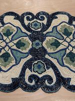 Close-up of central beadwork detailing and colors