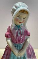 Front view of Tootless figurine showing facial details and attire