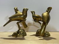 Both brass bird figurines front view
