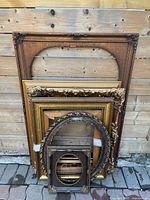 All frames leaning against fence