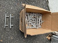 Box of 34 chrome T-bar drawer pulls with two separate examples shown