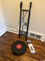 Group shot of all four fitness items: balance board, pull-up bar, boxed ankle brace, packaged yoga strap