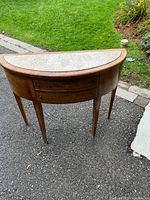 Front view displaying overall shape, drawers, legs