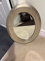 Front view showing oval mirror and painted wood frame