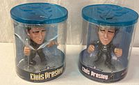 Two sealed Elvis Presley Funko Force bobbleheads in cylindrical cases