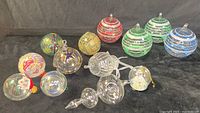 All 13 handblown glass ornaments displayed on black background