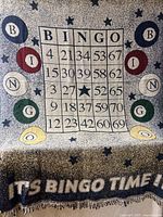 Full view of throw showing bingo card design and surrounding stars