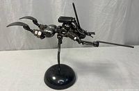 Front view of welded metal robot sculpture on base