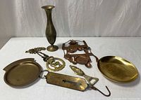Group shot of all brass and copper items on table