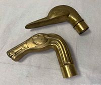 Top view of horse and duck head brass faucet handles