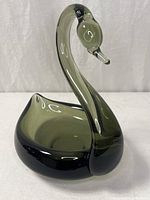Front view of smoky gray art glass swan figurine