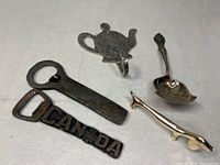 Group shot of all five metal items on fabric background