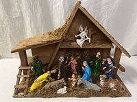 overall view of wooden stable and all figures positioned