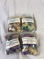 Group view of four fragrance salt bags