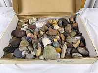 Open box showing full assortment of stones and rocks