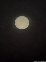 Reverse side of coin displaying ‘WINNIPEG 100’ design