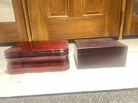 Two wooden humidors side by side closed