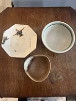 All three bowls top view showing shapes and glazes
