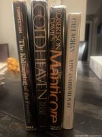 Spine view of all four hardcover books standing together