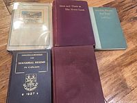 All five hardcover books laid out face up