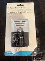 Front view of sealed Nexxtech 9-Range Battery Tester showing device and packaging