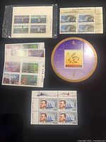 Group shot showing souvenir sheets, lighthouse block, artwork sheet, 45-cent block