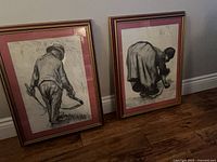 Both framed Van Gogh reproduction prints standing on floor