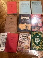 Group shot of nine books including hardcovers and softcovers