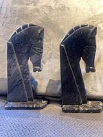 Front profile of both onyx horse head bookends showing height and detail