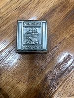 Top view showing pewter panel with Viking archer and Heilag Olav inscription