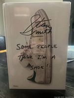 Front cover with title and Stan Smith sneaker image