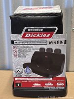 Front of packaged Dickies rear seat cover showing product branding and features
