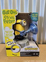 Front view of boxed Minions Gas Out toy