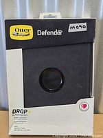 Front of retail box showing OtterBox Defender branding